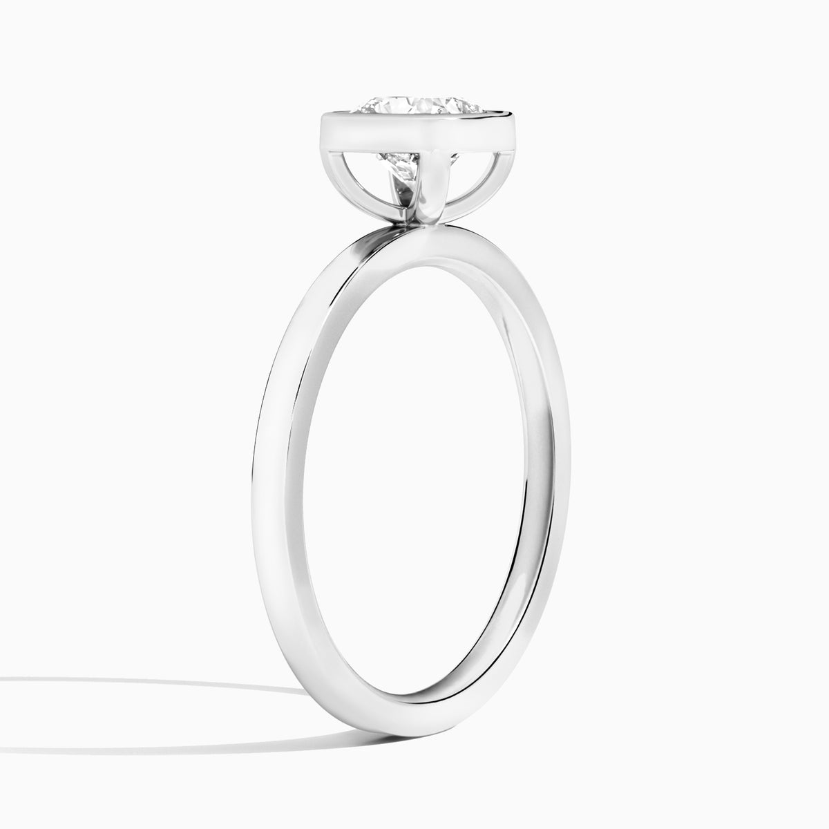 Cushion Vera Bezel Set Solitaire Diamond Engagement Ring In Platinum, Angle View