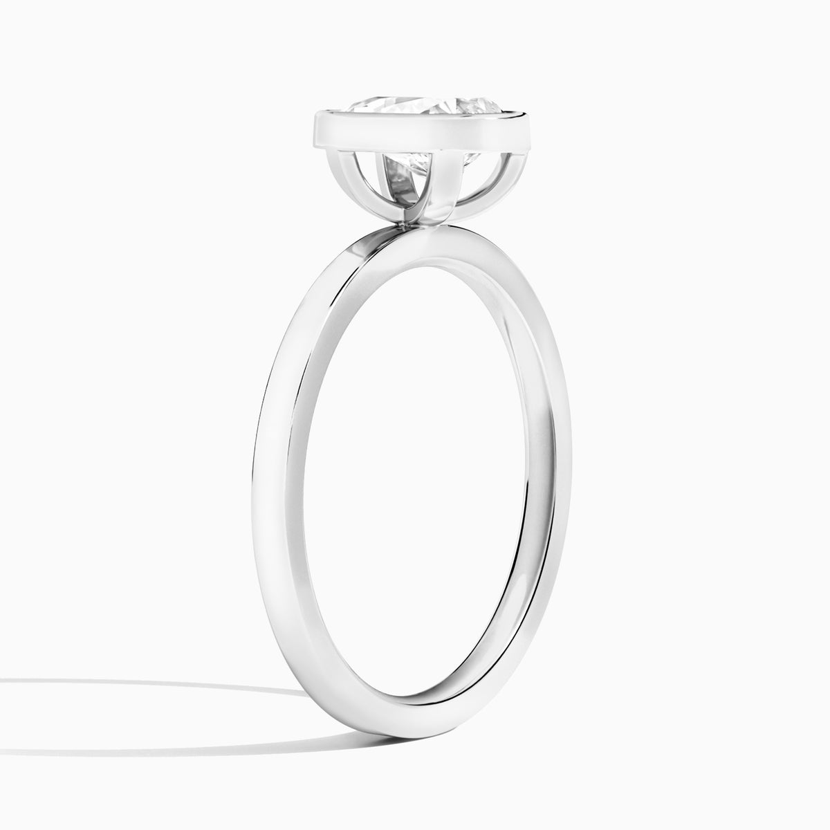 Pear Vera Bezel Set Solitaire Diamond Engagement Ring In Platinum, Angle View