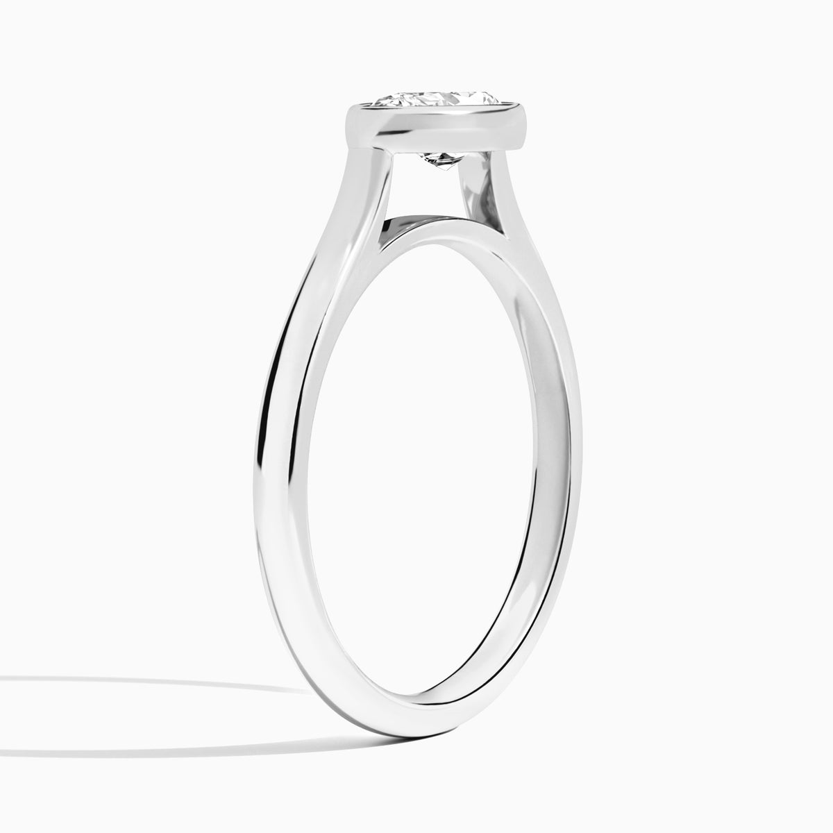 Pear Alma East-West Bezel Solitaire Diamond Engagement Ring In Platinum, Angle View