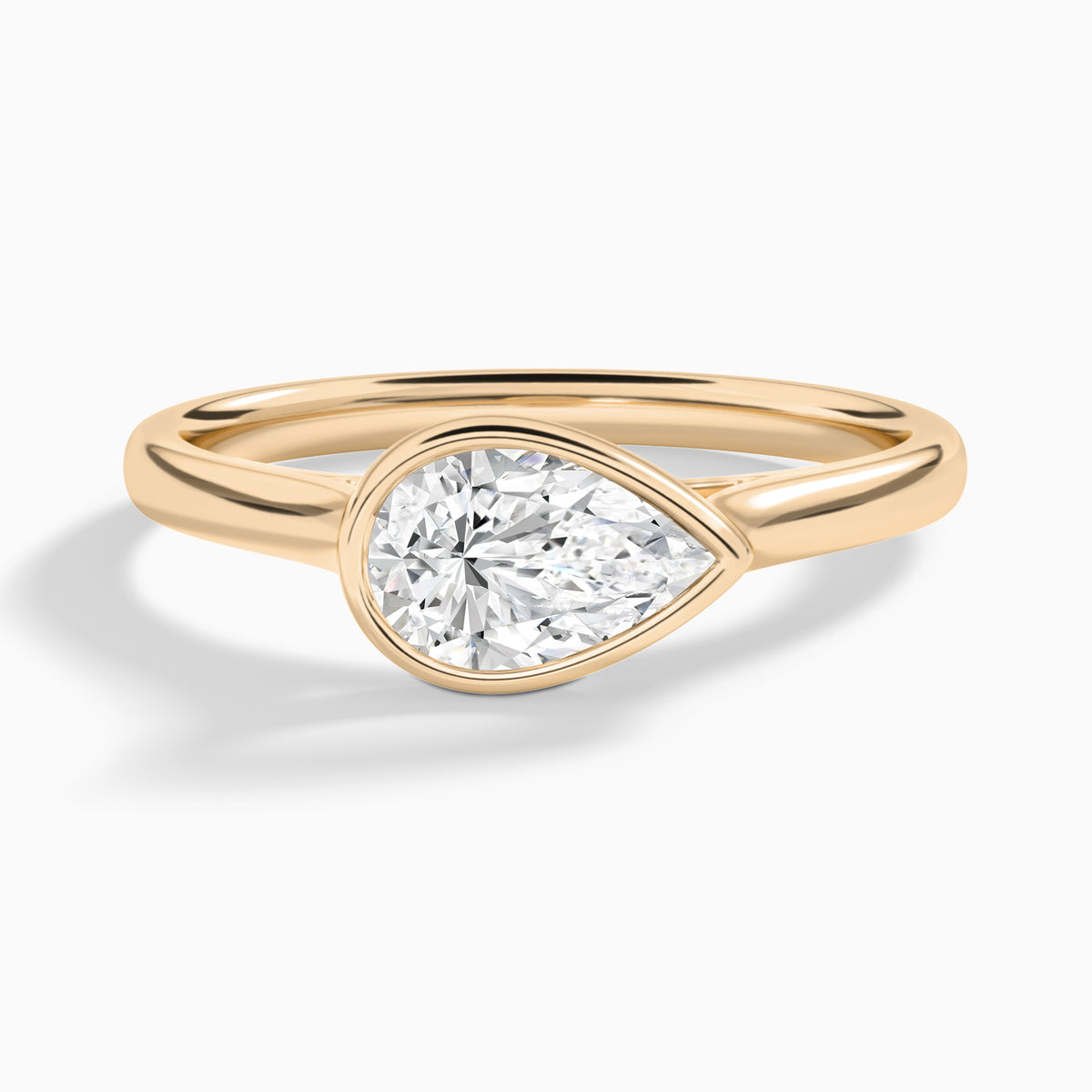 Pear Alma East-West Bezel Solitaire Diamond Engagement Ring In 14K Rose Gold - Lucenjuri