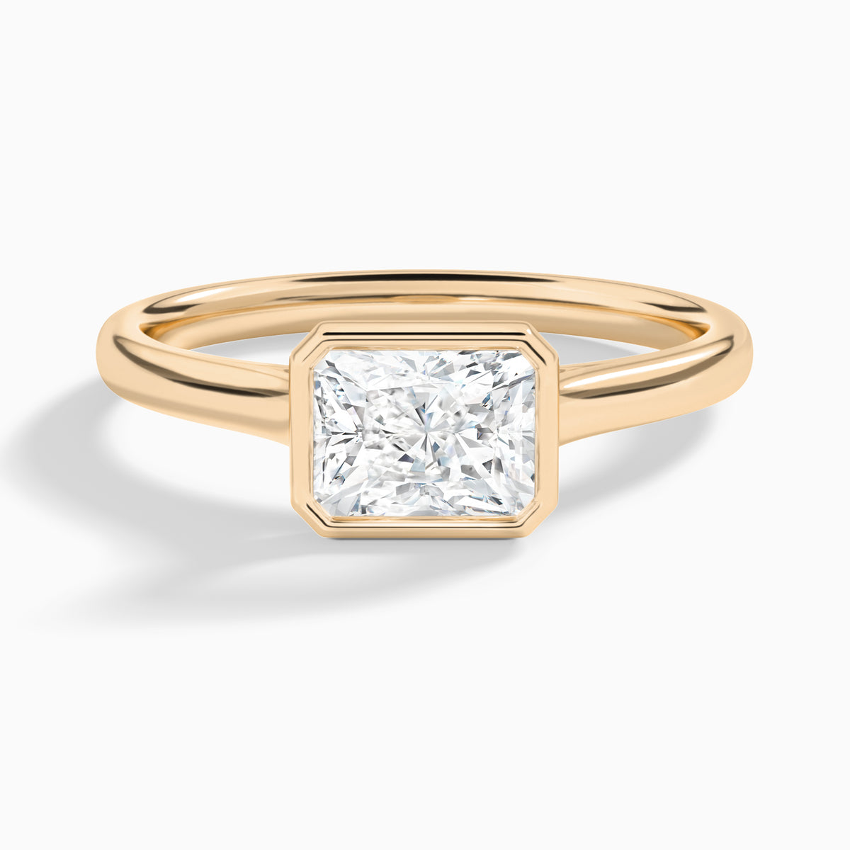Radiant Alma East-West Bezel Solitaire Diamond Engagement Ring In 14K Rose Gold - Lucenjuri