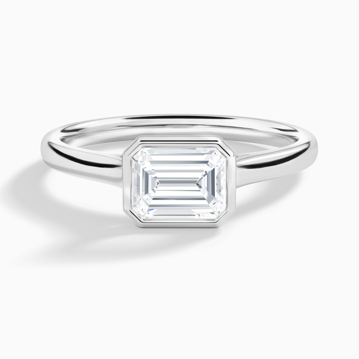 Emerald Alma East-West Bezel Solitaire Diamond Engagement Ring In 18K White Gold - Lucenjuri