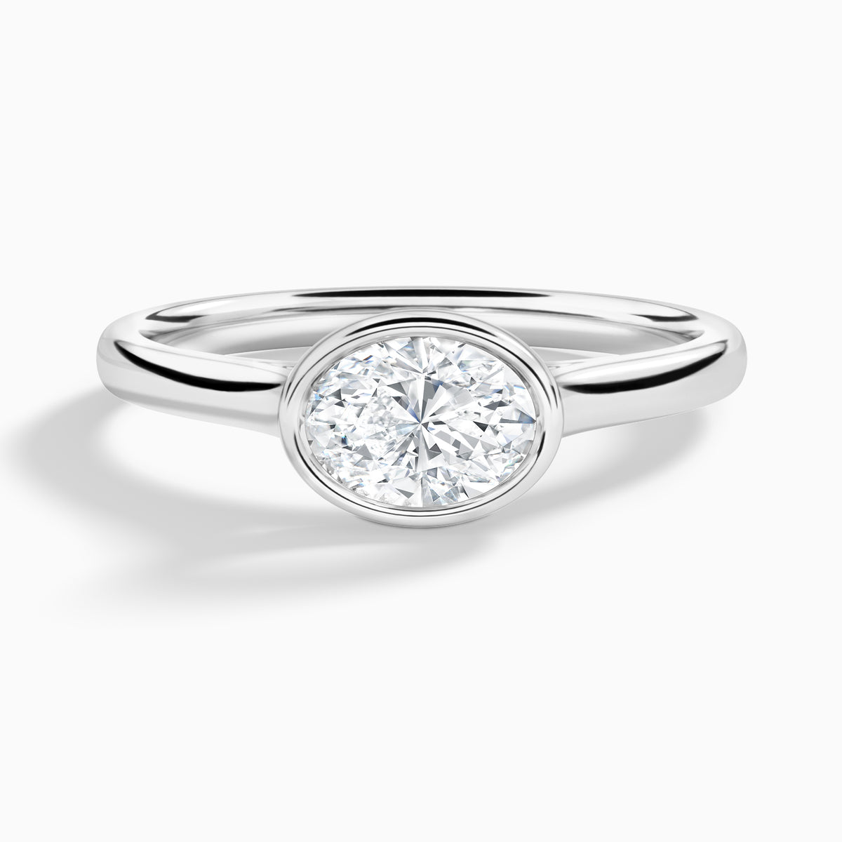 Oval Alma East-West Bezel Solitaire Diamond Engagement Ring In 18K White Gold - Lucenjuri