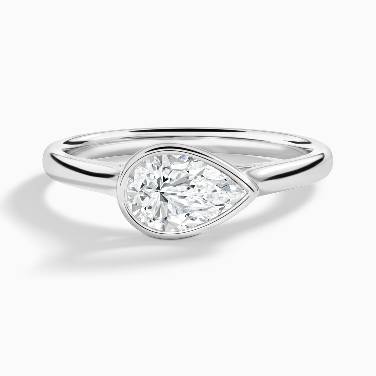 Pear Alma East-West Bezel Solitaire Diamond Engagement Ring In 18K White Gold - Lucenjuri