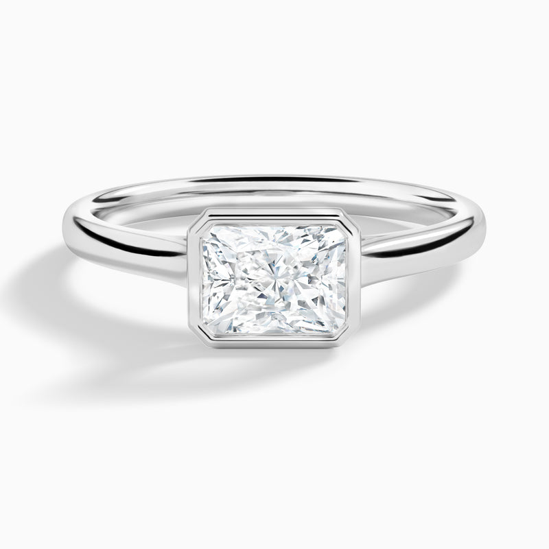 Radiant Alma East-West Bezel Solitaire Diamond Engagement Ring In 18K White Gold - Lucenjuri