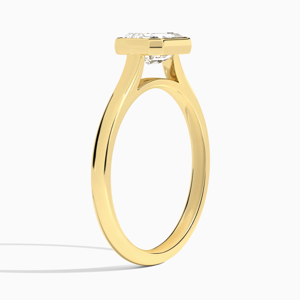 Emerald Alma East-West Bezel Solitaire Diamond Engagement Ring In 18K Yellow Gold, Angle View