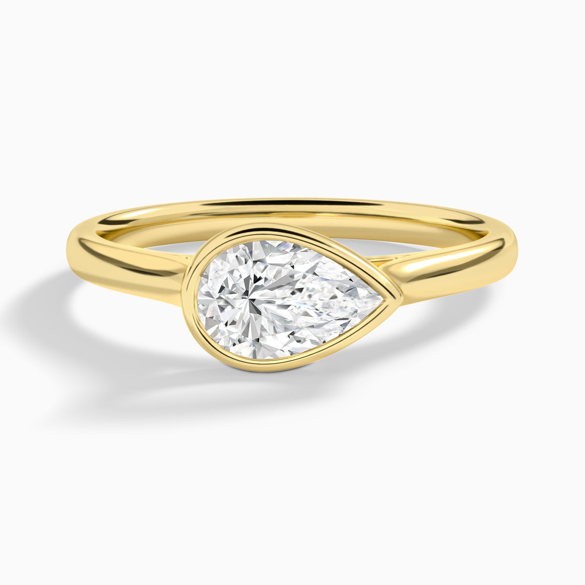 Pear Alma East-West Bezel Solitaire Diamond Engagement Ring In 18K Yellow Gold - Lucenjuri