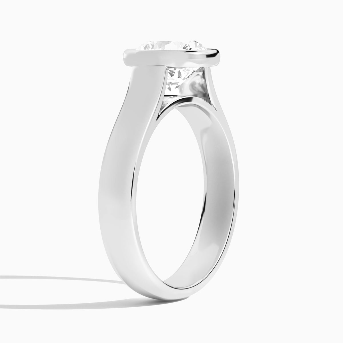 Round Alma 4mm Bezel Solitaire Diamond Engagement Ring In 18K White Gold, Angle View