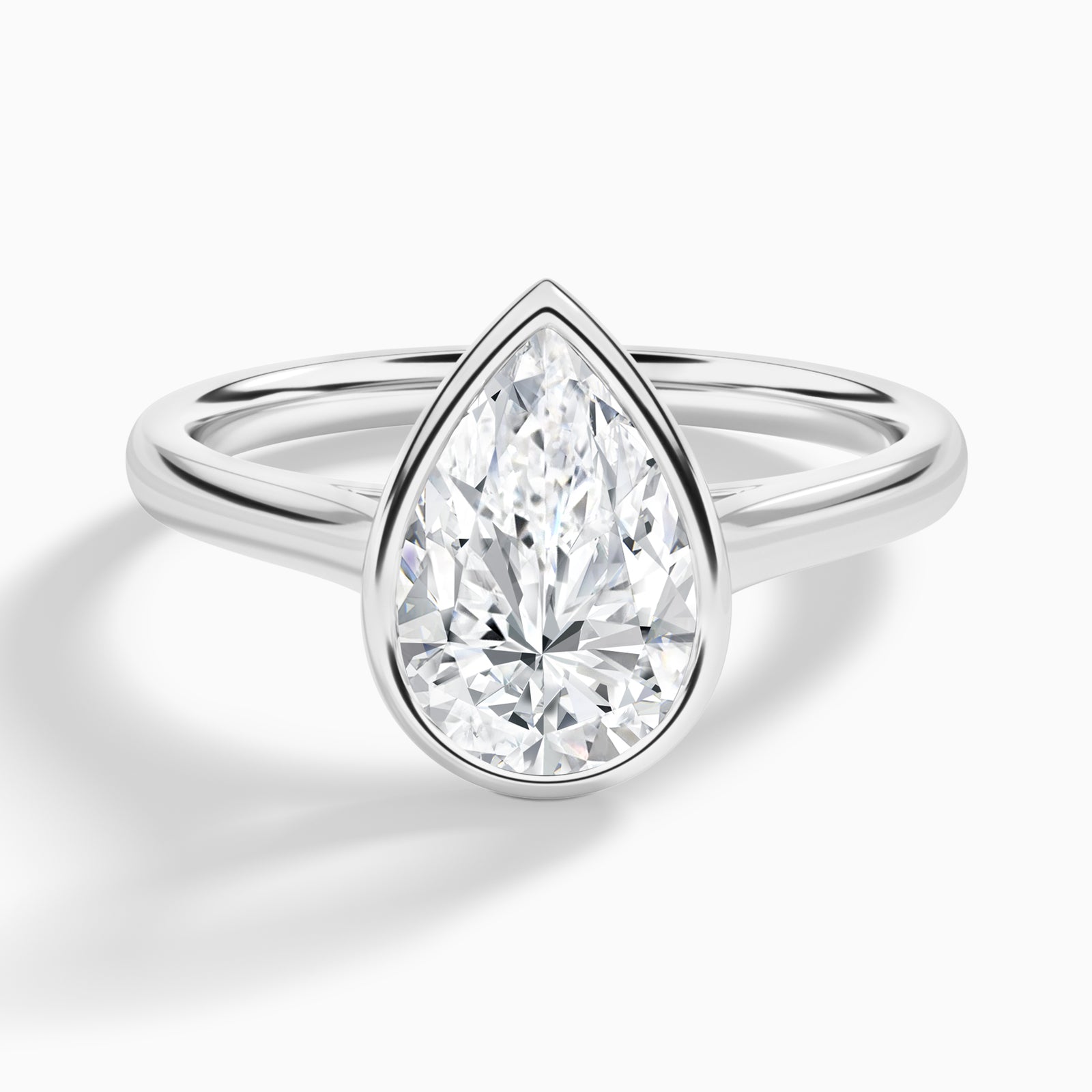 Pear Alma 2mm Bezel Solitaire Diamond Engagement Ring In 18K White Gold - Lucenjuri