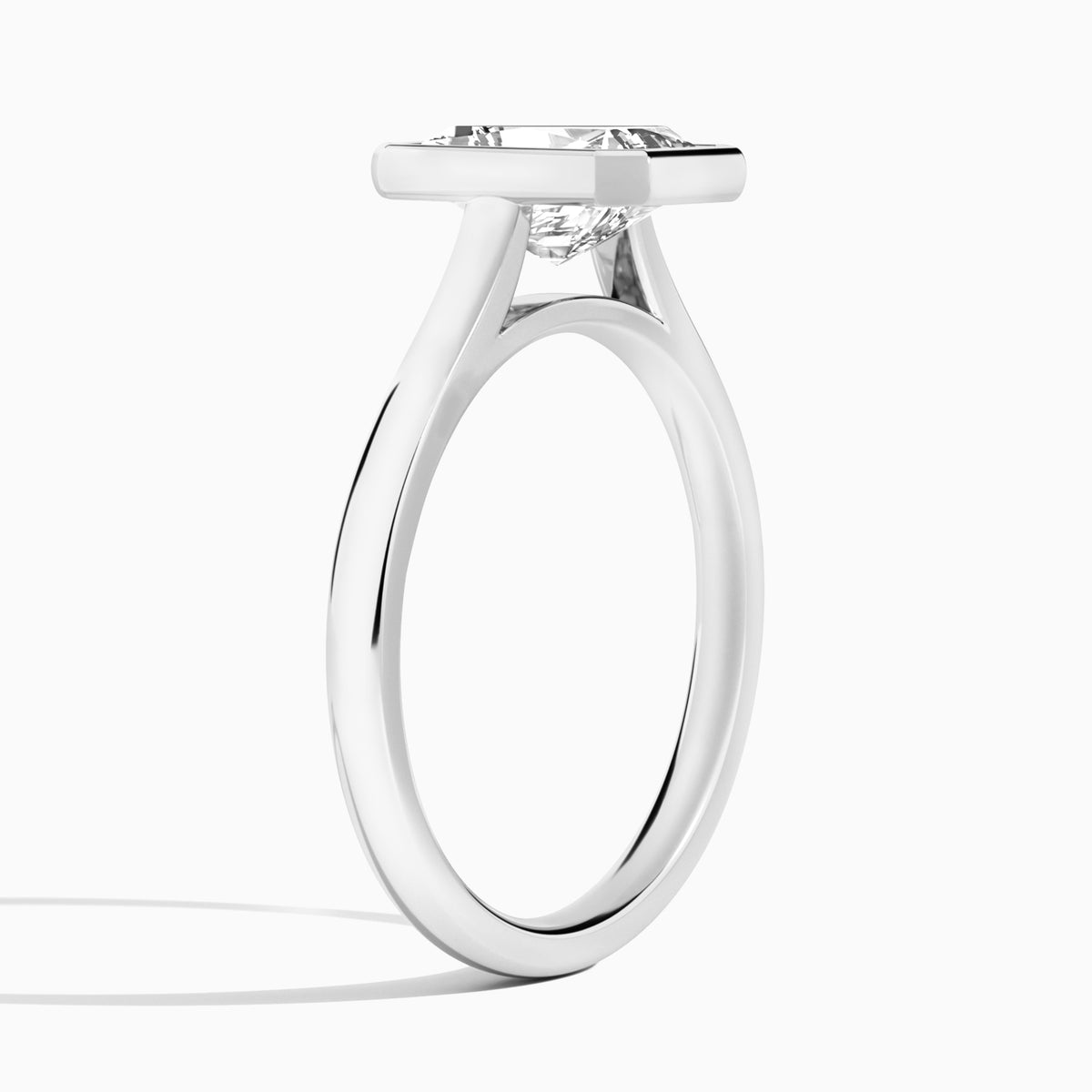 Radiant Alma 2mm Bezel Solitaire Diamond Engagement Ring In 18K White Gold, Angle View