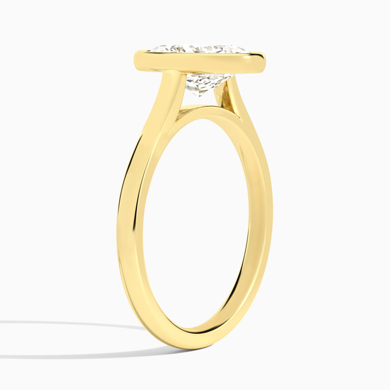 Oval Alma 2mm Bezel Solitaire Diamond Engagement Ring In 18K Yellow Gold, Angle View