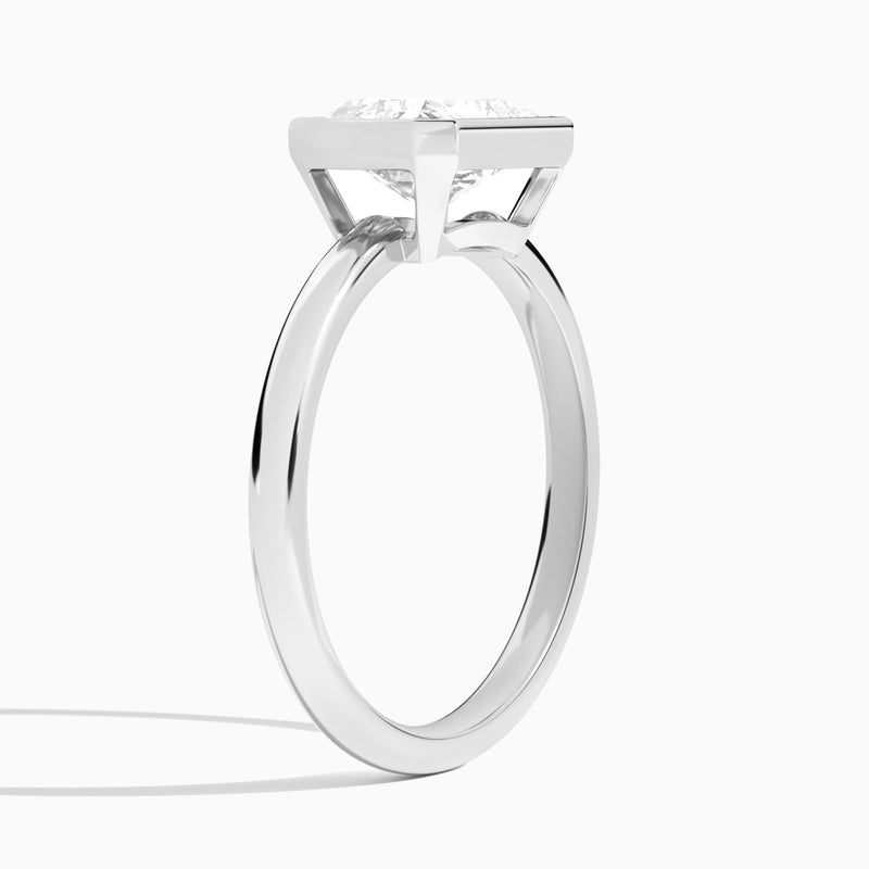 Radiant Elle East-West 2mm Bezel Solitaire Diamond Engagement Ring In 18K White Gold, Angle View