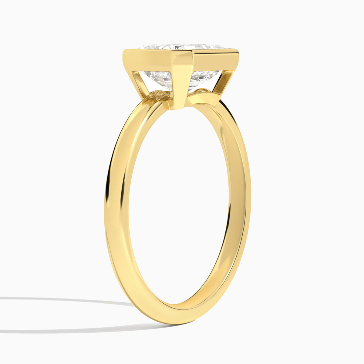 Emerald Elle East-West 2mm Bezel Solitaire Diamond Engagement Ring In 18K Yellow Gold, Angle View