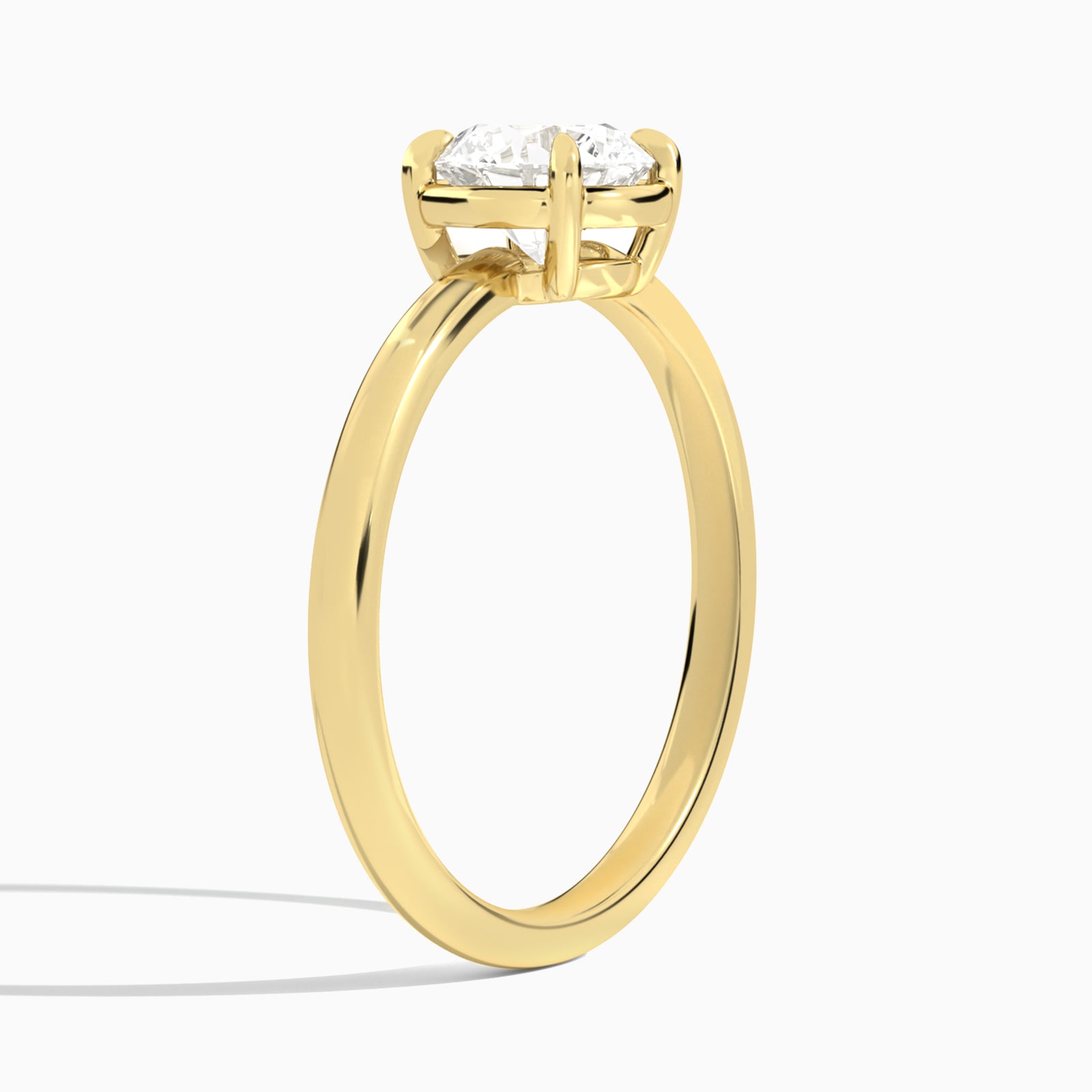 Round Prong Bezel Solitaire Diamond Engagement Ring In 18K Yellow Gold, Angle View