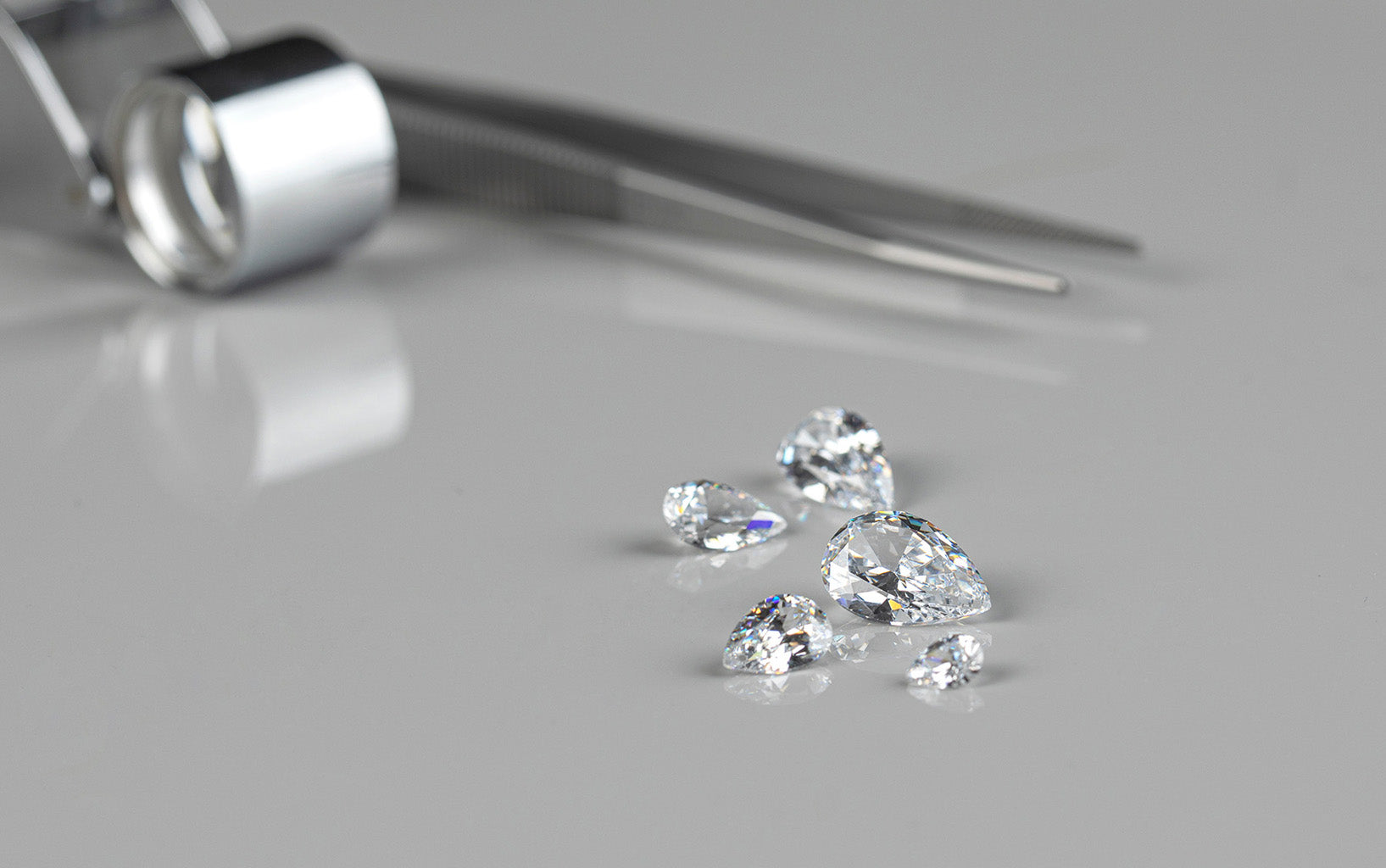 Beautiful lab grown diamonds on a gray background