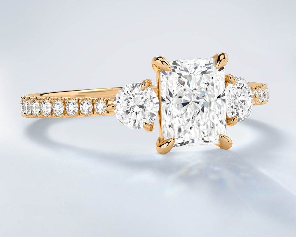 Rose gold ring with a large lab grown diamond on a light gray background