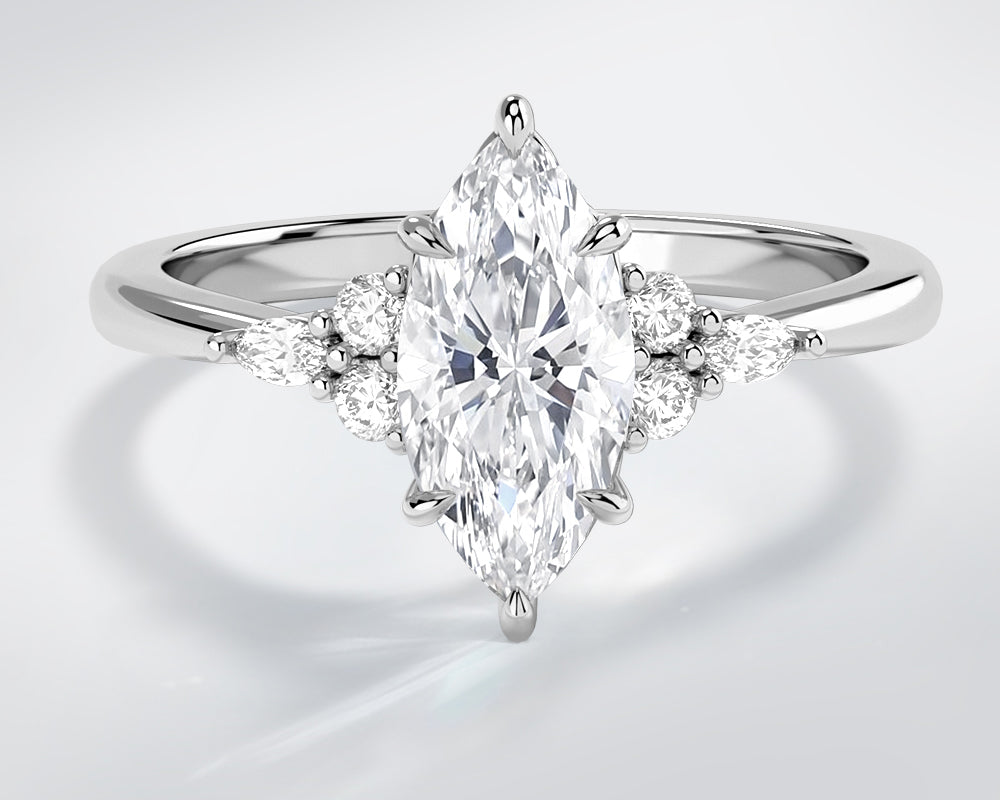 Lab grown diamond ring with a marquise-shaped center stone in 14k white gold on a light gray background