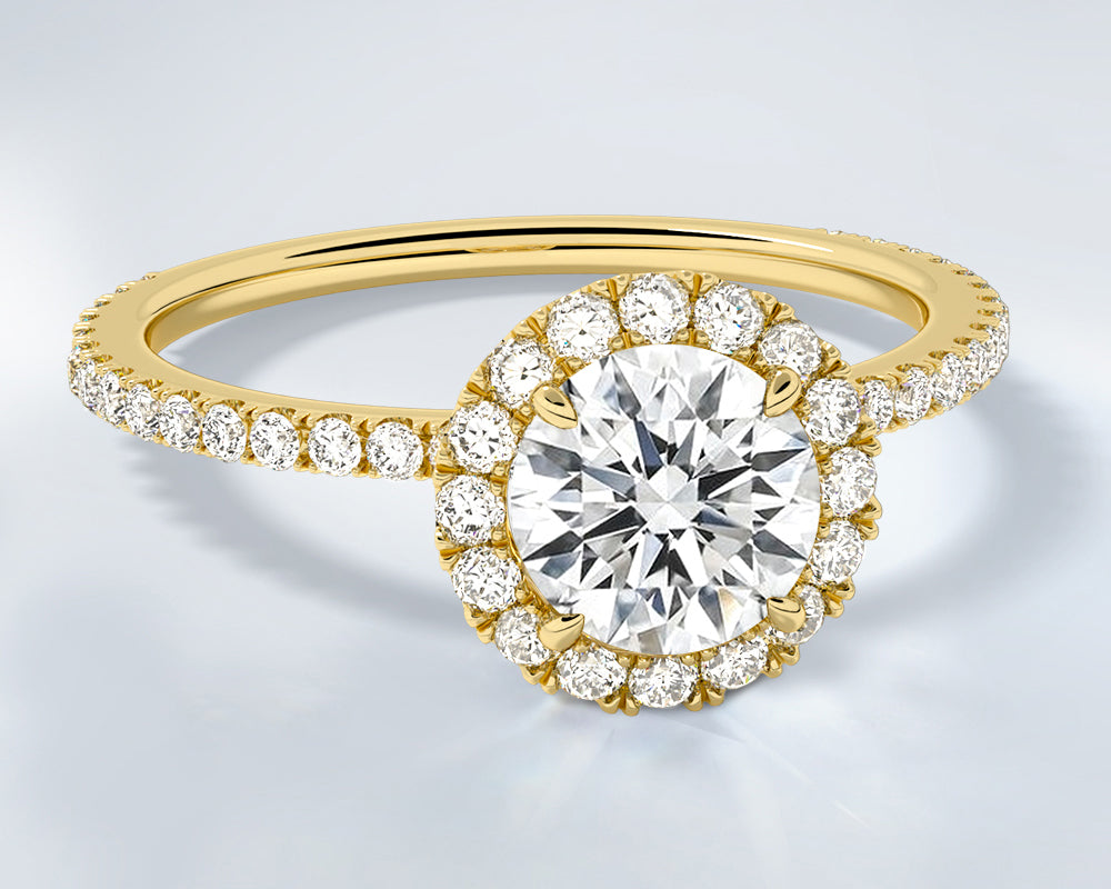 14K yellow gold engagement ring with a large round lab diamond on a light gray background