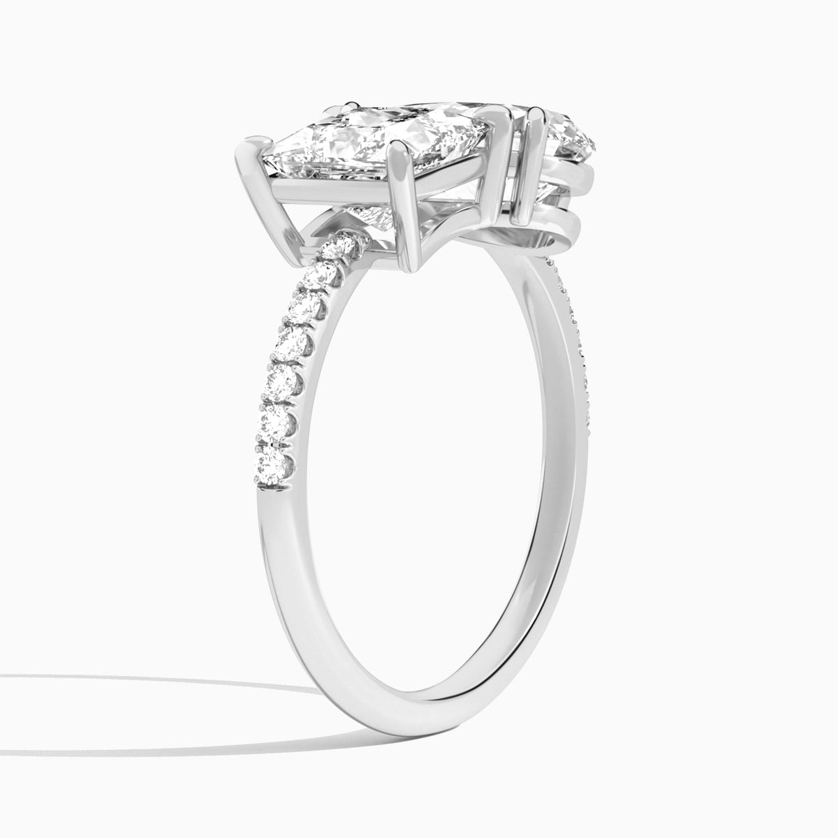 Toi Et Moi Princess and Pear Accented Diamond Engagement Ring In Platinum, Angle View