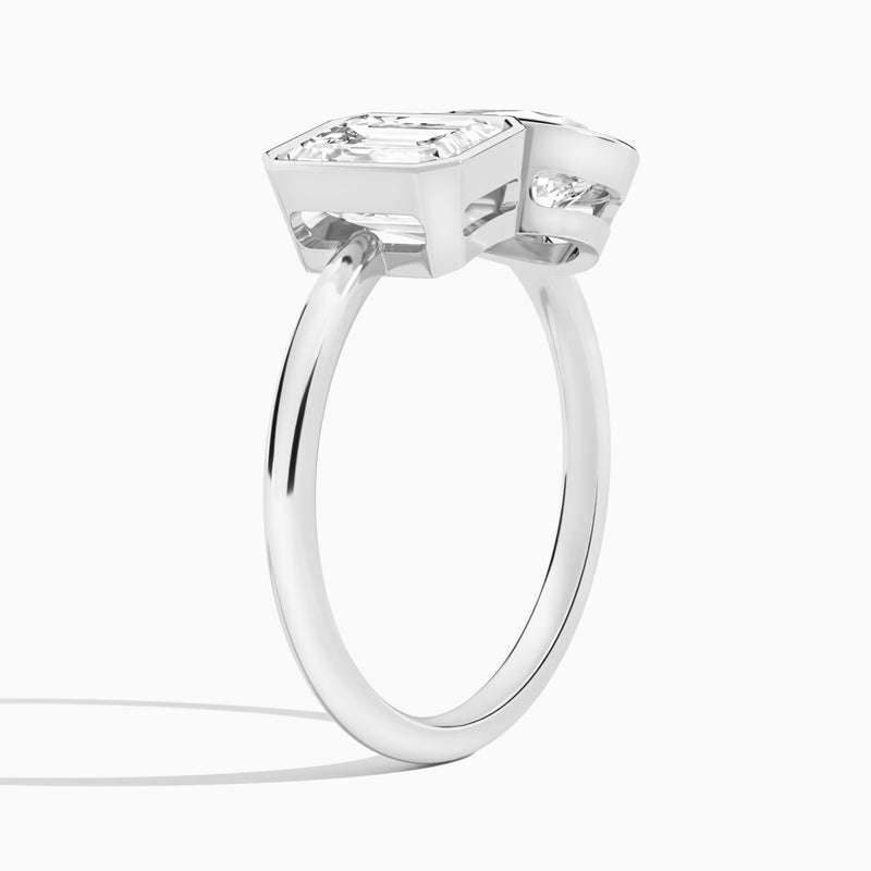 Bezel Toi Et Moi Emerald and Pear Diamond Engagement Ring In 14K White Gold, Angle View