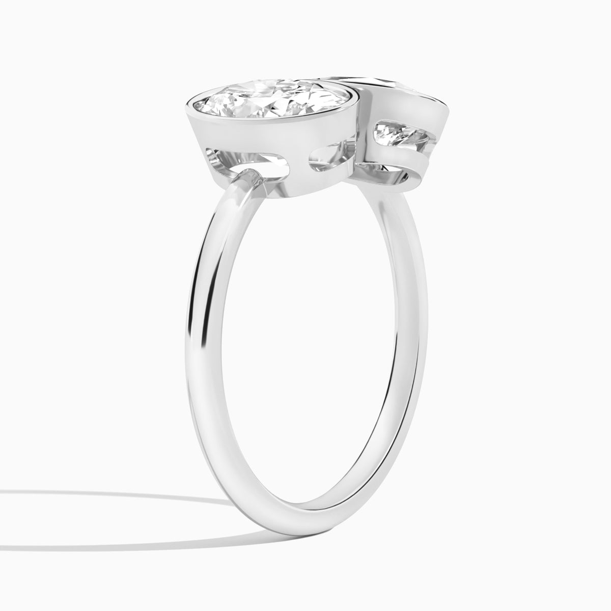 Bezel Toi Et Moi Oval and Pear Diamond Engagement Ring In Platinum, Angle View