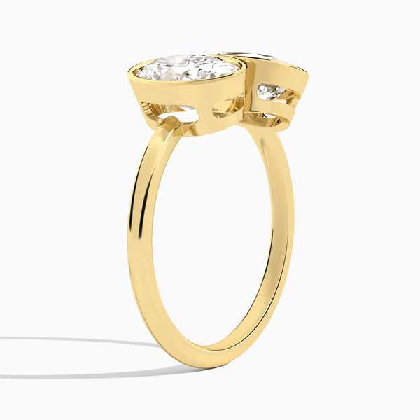 Bezel Toi Et Moi Oval and Pear Diamond Engagement Ring In 14K Yellow Gold, Angle View