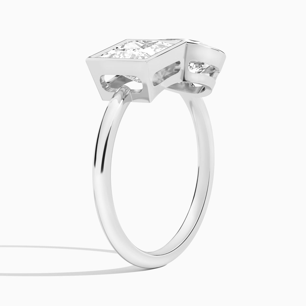 Bezel Toi Et Moi Princess and Pear Diamond Engagement Ring In Platinum, Angle View