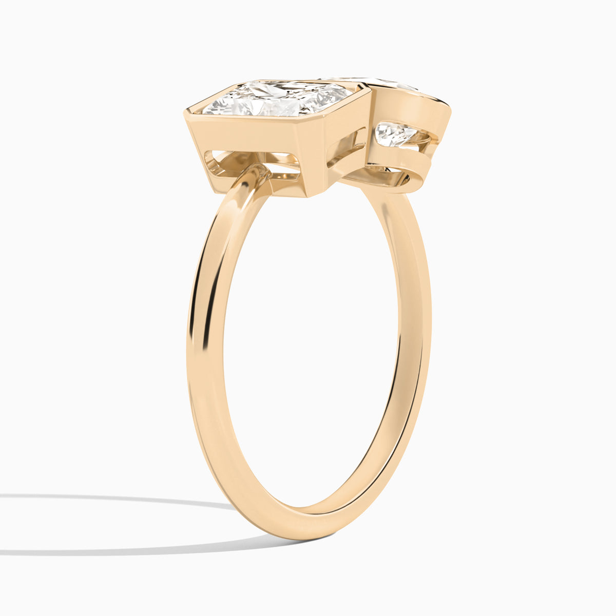 Bezel Toi Et Moi Radiant and Pear Diamond Engagement Ring In 14K Rose Gold, Angle View