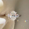 Three-stone oval engagement ring, twisted pavé diamond band, custom oval bridal jewelry, white gold three-stone diamond ring.