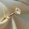Luxury gold lab diamond ring close-up, diamond fire and brilliance, elegant jewelry photography on silk.