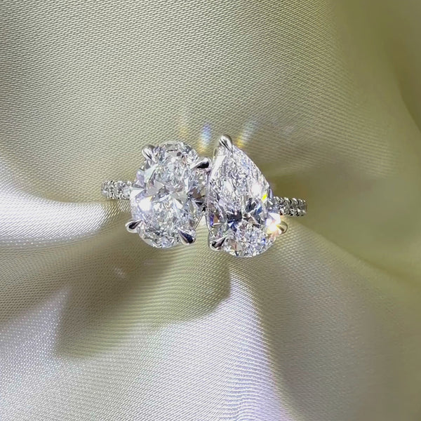 Oval and pear cut Toi et Moi ring, pavé diamond engagement ring, two-stone custom bridal jewelry, luxury diamond wedding ring.