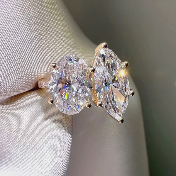 Yellow gold Toi et Moi ring, oval and marquise cut diamond jewelry, yellow gold pavé engagement ring, custom two-stone ring design.
