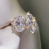 Yellow gold Toi et Moi ring, oval and marquise cut diamond jewelry, yellow gold pavé engagement ring, custom two-stone ring design.