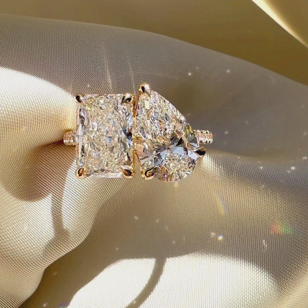 Radiant and pear cut Toi et Moi ring, yellow gold pavé engagement ring, custom two-stone diamond jewelry, luxury radiant cut bridal ring.