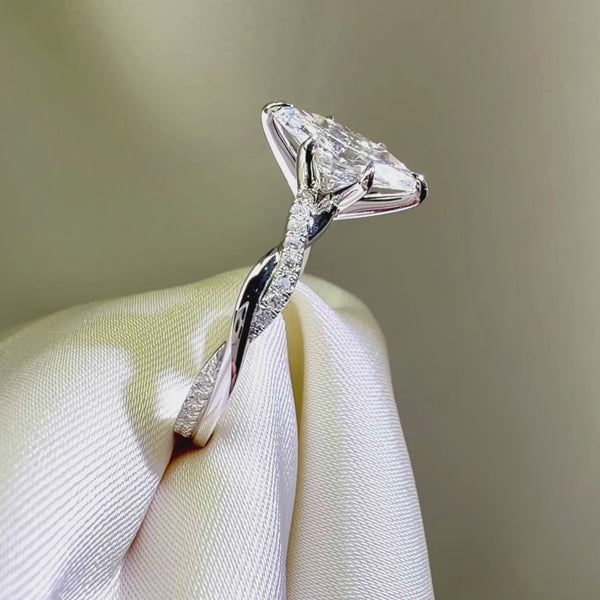 Marquise diamond engagement ring, white gold twisted band, pavé diamond ring side view, custom bridal jewelry.