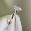 Marquise diamond engagement ring, white gold twisted band, pavé diamond ring side view, custom bridal jewelry.