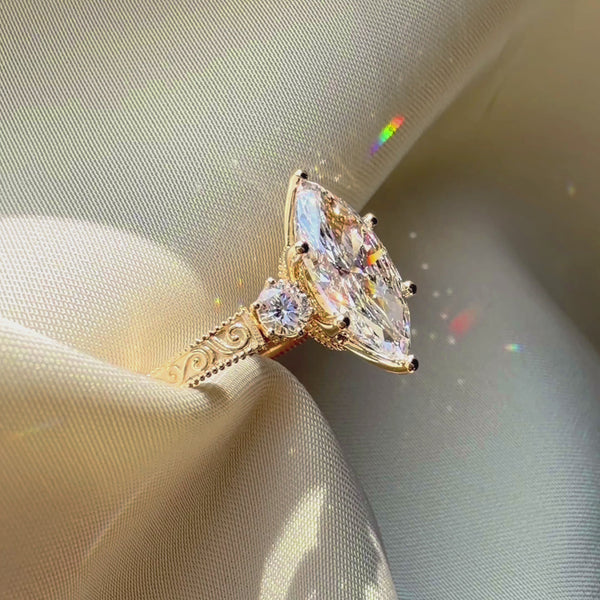 Engraved gold engagement ring, vintage marquise diamond ring side view, custom 3-stone ring, handcrafted luxury jewelry.